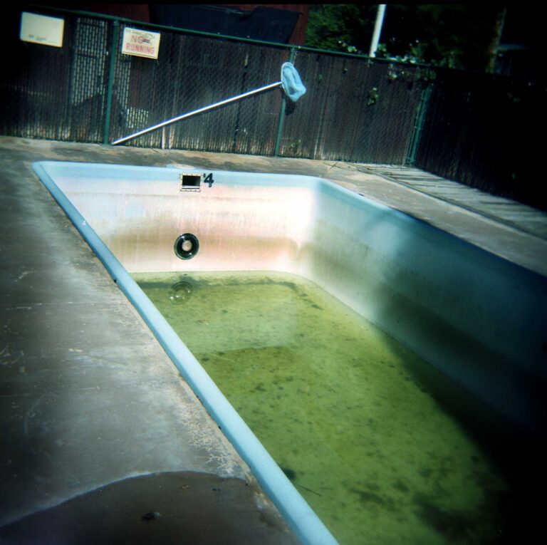 Drained, dilapidated pool at a cheap motel